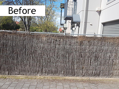 brush fence needing repair