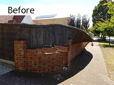 Damaged brush fence Adelaide needing repair